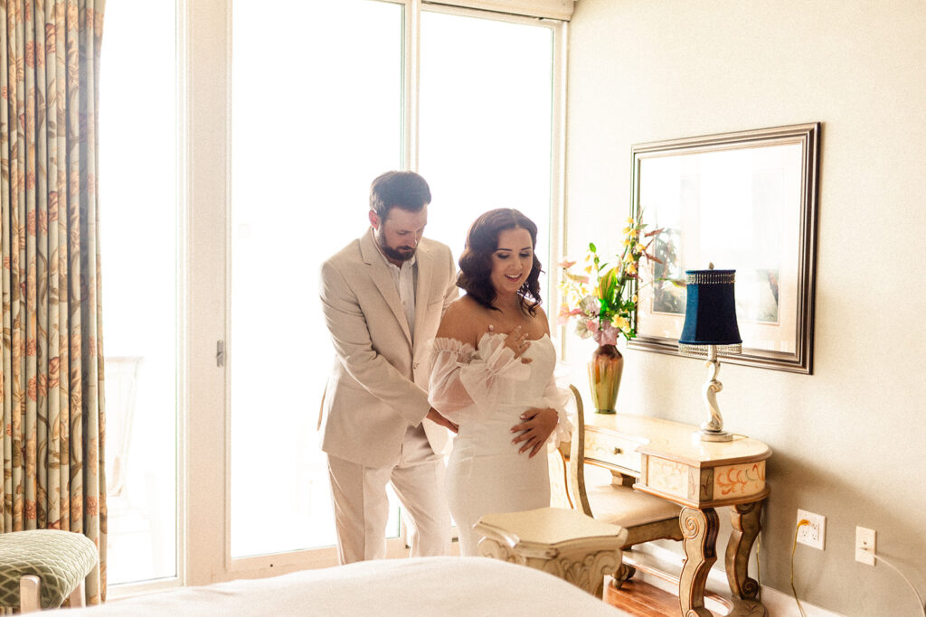 bride and groom getting ready in hotel room wedding planning